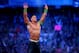 FILE- In this Sunday, April 6, 2014 file photo, John Cena celebrates his win during Wrestlemania XXX at the Mercedes-Benz Super Dome in New Orleans. World-famous WWE wrestlers such as John Cena, Shaemus and champion Randy Orton are in Saudi Arabia for three days of matches in the capital Riyadh. (Jonathan Bachman/AP Images for WWE, File)