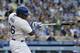 Los Angeles Dodgers right fielder Yasiel Puig hits a double against the Cleveland Indians during the first inning of a baseball game in Los Angeles, Tuesday, July 1, 2014. (AP Photo/Chris Carlson)