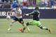 Cristian Ceballos moves past Seattle Sounders' Jalil Anibaba during Tottenham Hotspur's 3-3 pre season draw.