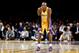 Los Angeles Lakers guard Kobe Bryant watches his team during an NBA basketball game against the Phoenix Suns in Los Angeles, Tuesday, Dec. 10, 2013. (AP Photo/Chris Carlson)