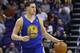 Golden State Warriors' Klay Thompson dribbles the ball against the Phoenix Suns during the first half of an NBA basketball game Saturday, Feb. 8, 2014, in Phoenix. The Suns defeated the Warriors 122-109. (AP Photo/Ross D. Franklin)