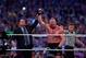 Paul Heyman, left, celebrates with Brock Lesnar after his win over the Undertaker during Wrestlemania XXX at the Mercedes-Benz Super Dome in New Orleans on Sunday, April 6, 2014. (Jonathan Bachman/AP Images for WWE)