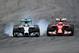 HOCKENHEIM, GERMANY - JULY 20: Lewis Hamilton of Great Britain and Mercedes GP locks up as he passes Kimi Raikkonen of Finland and Ferrari during the German Grand Prix at Hockenheimring on July 20, 2014 in Hockenheim, Germany. (Photo by Christopher Lee/Getty Images)