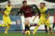 AC Milan's Bryan Cristante, center, is challenged by Chievo defender Luca Rigoni, right, during a Serie A soccer match at Bentegodi stadium in Verona, Italy, Sunday, Nov. 10, 2013. (AP Photo/Felice Calabro')