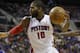 Detroit Pistons forward Greg Monroe (10) chases a loose ball during the second half of an NBA basketball game against the Chicago Bulls at the Palace in Auburn Hills, Mich., Wednesday, Nov. 27, 2013. (AP Photo/Carlos Osorio)