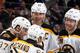UNIONDALE, NY - JANUARY 27: Zdeno Chara #33, Patrice Bergeron #37, Brad Marchand #63, and Dougie Hamilton #27 of the Boston Bruins celebrate a goal credited to Chara in the third period of an NHL hockey game against the New York Islanders at Nassau Veterans Memorial Coliseum on January 27, 2014 in Uniondale, New York. Boston won 6-3. (Photo by Paul Bereswill/Getty Images)