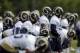 Members of the St. Louis Rams warm up during training camp at the NFL football team's practice facility Friday, Aug. 16, 2013, in St. Louis. (AP Photo/Jeff Roberson)