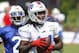 Buffalo Bills wide receiver Sammy Watkins (14) makes a reception against corner back Leodis McKelvin (21) during their NFL football training camp in Pittsford, N.Y., Monday, July 21, 2014. (AP Photo/Bill Wippert)
