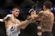 Rafael dos Anjos from Brazil, right and Khabib Nurmagomedov from Russia fight in a mixed martial arts event on Saturday, April 19, 2014, at UFC Fight Night in Orlando Fla.. Nurmagomedov won. (AP Photo/Reinhold Matay)