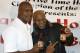 Former heavyweight champions Mike Tyson, right, and Evander Holyfield during a promotional event for Holyfield's Real Deal barbecue sauce at a Chicago grocery store Saturday, Feb. 16, 2013. (AP Photo/Charlie Arbogast)