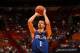 MIAMI, FL - April 16: Michael Carter-Williams #1 of the Philadelphia 76ers shoots against the Miami Heat at the American Airlines Arena in Miami, Florida on April 16, 2014. NOTE TO USER: User expressly acknowledges and agrees that, by downloading and/or using this photograph, user is consenting to the terms and conditions of the Getty Images License Agreement. Mandatory copyright notice: Copyright NBAE 2014 (Photo by Issac Baldizon/NBAE via Getty Images)