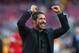 BARCELONA, SPAIN - MAY 17: Diego Simeone the coach of Club Atletico de Madrid celebrates towards his supporters after winning the La Liga after the match between FC Barcelona and Club Atletico de Madrid at Camp Nou on May 17, 2014 in Barcelona, Spain. (Photo by Alex Livesey/Getty Images)