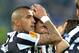 Juventus midfielder Claudio Marchisio, center, celebrates after scoring with teammate Arturo Vidal during the Europa League quarterfinal soccer match between Juventus and Olympic Lyon at the Juventus stadium, in Turin, Italy, Thursday, April 10, 2014. (AP Photo/ Massimo Pinca)