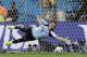 Costa Rica's goalkeeper Keylor Navas dives trying to save a penalty kick during penalty kicks at the World Cup quarterfinal soccer match between the Netherlands and Costa Rica at the Arena Fonte Nova in Salvador, Brazil, Saturday, July 5, 2014. The Netherlands won 4-3 on penalty kicks. (AP Photo/Hassan Ammar)