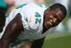Miami Dolphins tight end Charles Clay (42) warms up before an NFL football game against the Carolina Panthers, Sunday, Nov. 24, 2013, in Miami Gardens, Fla. (AP Photo/J Pat Carter)