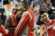 PORTLAND, OR - APRIL 25: Troy Daniels #30 of the Houston Rockets is mobbed by teammates after hitting what ended up being the game winning shot during overtime of Game Three of the Western Conference Quarterfinals during the 2014 NBA Playoffs against the Portland Trail Blazers at the Moda Center on April 25, 2014 in Portland, Oregon. The Rockets won the game 121-116. NOTE TO USER: User expressly acknowledges and agrees that, by downloading and or using this photograph, User is consenting to the terms and conditions of the Getty Images License Agreement. (Photo by Steve Dykes/Getty Images)