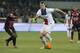 Paris Saint Germain's Zlatan Ibrahimovic of Sweden, right challenges for the ball with Nice's Nampalys Mendy of France during their French League One soccer match, in Nice stadium,southeastern France, Friday, March 28, 2014. (AP Photo/Lionel Cironneau)