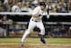 New York Yankees Derek Jeter grimaces as he runs to first after hitting into a fifth-inning bases-loaded double play in a baseball game at Yankee Stadium in New York, Monday, July 21, 2014. (AP Photo/Kathy Willens)
