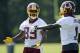 Washington Redskins wide receiver Santana Moss (89) talks with DeSean Jackson (1) during NFL football minicamp, Wednesday, June 18, 2014, in Ashburn, Va. (AP Photo/Nick Wass)