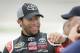Darrell Wallace Jr. reacts with crew members after winning the pole position during qualifying for the NASCAR Trucks Series auto race, Friday, July 11, 2014, at Iowa Speedway in Newton, Iowa. (AP Photo/Charlie Neibergall)
