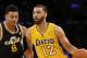 Los Angeles Lakers' Kendall Marshall, right, dribbles the ball past Utah Jazz's Diante Garrett, left, during the second half of an NBA basketball game in Los Angeles, Tuesday, Feb. 11, 2014. The Jazz won 96-79. (AP Photo/Danny Moloshok)