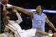 Iowa State guard DeAndre Kane (50) tries to shoot as North Carolina forward Kennedy Meeks (3) defends during the second half of a third-round game in the NCAA college basketball tournament Sunday, March 23, 2014, in San Antonio. (AP Photo/David J. Phillip)