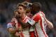 LONDON, ENGLAND - APRIL 19: Fabio Borini of Sunderland is mobbed by team mates after scoring the winner from the penalty spot during the Barclays Premier League match between Chelsea and Sunderland at Stamford Bridge on April 19, 2014 in London, England. (Photo by Mike Hewitt/Getty Images)
