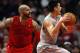 Dec 25, 2012; Chicago, IL, USA; Houston Rockets point guard Jeremy Lin (right) is fouled by Chicago Bulls power forward Carlos Boozer (5) during the third quarter at the United Center. Mandatory Credit: Jerry Lai-USA TODAY Sports
