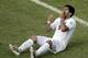 FILE - In this June 24, 2014 file photo, Uruguay's Luis Suarez reacts on the pitch during the group D World Cup soccer match between Italy and Uruguay at the Arena das Dunas in Natal, Brazil. On Thursday, June 26, 2014, FIFA banned Suarez for 9 games and 4 months for biting his opponent at the World Cup. (AP Photo/Hassan Ammar, File)