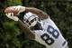 Dallas Cowboys wide receiver Dez Bryant grabs a pass from a throwing machine during an NFL football organized team activity, Tuesday, May 27, 2014, in Irving, Texas. (AP Photo/Tony Gutierrez)