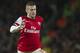 Arsenal's Jack Wilshere, controls the ball against Cardiff City, during their English Premier League match, at Emirates Stadium, in London, Wednesday, Jan. 1, 2014. (AP Photo/Bogdan Maran)
