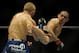 May 24, 2014; Las Vegas, NV, USA; Renan Barao (red) throws a kick at TJ Dillashaw (blue) during their UFC 173 bantamweight championship bout at MGM Grand Garden Arena. Dillashaw won the bout by way of TKO. Mandatory Credit: Stephen R. Sylvanie-USA TODAY Sports