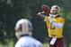 Washington Redskins quarterback Robert Griffin III (10) looks to pass during an NFL football minicamp, Tuesday, June 17, 2014, in Ashburn, Va. (AP Photo/Nick Wass)