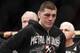 Nick Diaz reacts after Carlos Condit wins a unanimous decision just after their UFC interim welterweight mixed martial arts title match, Saturday, Feb. 4, 2012 at The Mandalay Bay Resort & Casino in Las Vegas. (AP Photo/Eric Jamison)