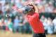 HOYLAKE, ENGLAND - JULY 20: Tiger Woods of the United States hits his second shot on the 18th hole during the final round of The 143rd Open Championship at Royal Liverpool on July 20, 2014 in Hoylake, England. (Photo by Andrew Redington/Getty Images)