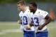 Indianapolis Colts tight ends Dwayne Allen, right, and Coby Fleener runs off the field during the first practice of the NFL team's football rookie minicamp in Indianapolis, Friday, May 4, 2012. (AP Photo/Michael Conroy)