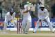 South African batsman Faf du Plessis, center, plays a shot as Sri Lankan wicketkeeper Dinesh Chandimal, left, and Mahela Jayawardene watch during the fourth day of the first test cricket mach between Sri Lanka and South Africa in Galle, Sri Lanka, Saturday, July 19, 2014. (AP Photo/Eranga Jayawardena)