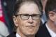 Liverpool's owner John William Henry II takes his place in the stands before his team's English Premier League soccer match against Manchester City at Anfield Stadium, Liverpool, England, Sunday April 13, 2014. (AP Photo/Jon Super)