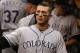 Colorado Rockies' Troy Tulowitzki walks in the dugout during a baseball game against the Pittsburgh Pirates in Pittsburgh Friday, July 18, 2014. The Pirates won 4-2. (AP Photo/Gene J. Puskar)