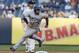 New York Yankees second baseman Brian Roberts (14) watches as Toronto Blue Jays Melky Cabrera turns past second base in a baseball game at Yankee Stadium in New York, Thursday, June 19, 2014. Cabrera was later picked off at second. (AP Photo/Kathy Willens)