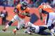 Jan 12, 2014; Denver, CO, USA; Denver Broncos running back Montee Ball (28) attempts to elude San Diego Chargers linebacker Manti Te'o (50) during the 2013 AFC divisional playoff football game at Sports Authority Field at Mile High. Mandatory Credit: Kirby Lee-USA TODAY Sports