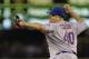 New York Mets starting pitcher Bartolo Colon throws against the Seattle Mariners during a baseball game, Wednesday, July 23, 2014 in Seattle. (AP Photo)