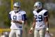 Dallas Cowboys quarterback Tony Romo (9) and teammate running back DeMarco Murray (29) talk things over at NFL training camp, Saturday, July 26, 2014, in Oxnard, Calif. (AP Photo/Gus Ruelas)