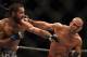 July 26, 2014; San Jose, CA, USA; Robbie Lawler (red gloves) punches Matt Brown (blue gloves) during the welterweight bout of the FOX UFC Saturday at SAP Center. Mandatory Credit: Kyle Terada-USA TODAY Sports