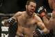 Matt Brown, left, throws a punch at Robbie Lawler during the fifth round of a welterweight mixed martial arts bout at a UFC on Fox event in San Jose, Calif., Saturday, July 26, 2014. Lawler won by unanimous decision. (AP Photo/Jeff Chiu)