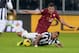 TURIN, ITALY - JANUARY 05: Arturo Vidal of FC Juventus falls in front of Kevin Strootman of AS Roma during the Serie A match between Juventus and AS Roma at Juventus Arena on January 5, 2014 in Turin, Italy. (Photo by Claudio Villa/Getty Images)