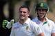 South African batsman Dean Elgar celebrates scoring a century, as teammate Faf du Plessis congratulates him during the first day of the first test cricket match between Sri Lanka and South Africa in Galle, Sri Lanka, Wednesday, July 16, 2014. (AP Photo/Eranga Jayawardena)