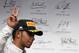 Mercedes driver Lewis Hamilton of Britain greets spectators after placing third in the Hungarian Formula One Grand Prix in Budapest, Hungary, Sunday, July 27, 2014. Hamilton placed third in the race. (AP Photo/Darko Vojinovic)