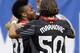 Liverpool FC forward Raheem Sterling (31) celebrates with midfielders Jordan Henderson and Lazar Markovic (50) after scoring a goal during the first half of a Guinness International Champions Cup soccer match against Olympiacos in Chicago, Sunday, July 27, 2014. (AP Photo/Nam Y. Huh)
