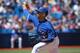 TORONTO, CANADA - JULY 24: Marcus Stroman #54 of the Toronto Blue Jays delivers a pitch in the first inning during MLB game action against the Boston Red Sox on July 24, 2014 at Rogers Centre in Toronto, Ontario, Canada. (Photo by Tom Szczerbowski/Getty Images)